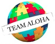 Colorful jigsaw puzzle globe with "Team Aloha" banner, symbolizing unity and collaboration.