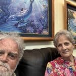 Colorful marine life paintings of dolphins and tropical fish at Dream Maui art gallery in Hawaii.